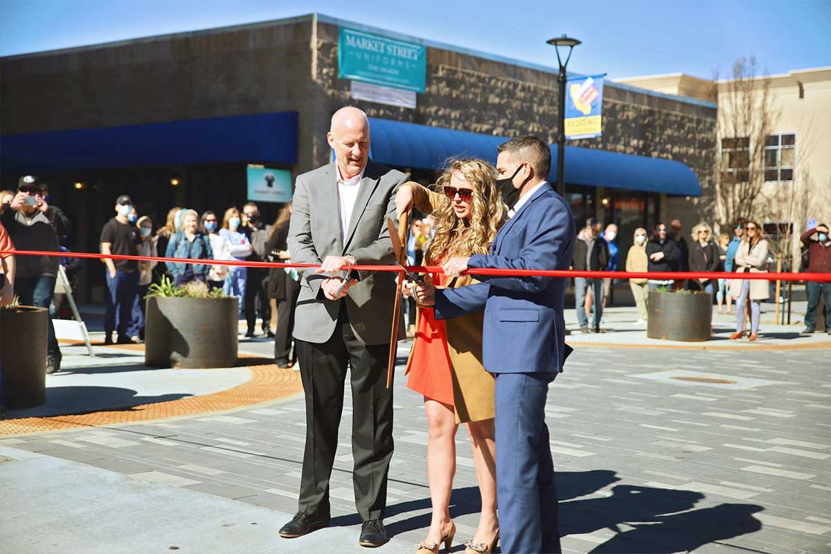Photo of ribbon cutting at Market Street grand reopening.